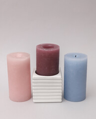 Concrete mold with candle on gray background