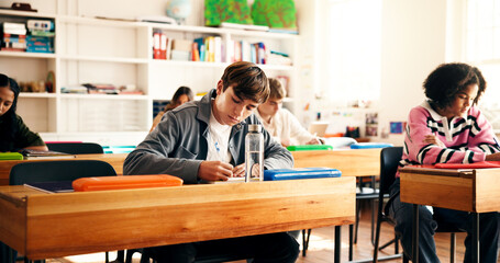 Teenager, students and writing notes in classroom for education, lesson revision and quiz. Children, learner and learning with high school assignment, studying and information for academic curriculum