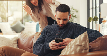 Man, phone and ignore woman on sofa with social media addiction, talk and gesture for attention....