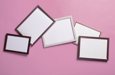 Blank wall frames on pink background