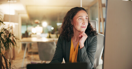 Computer, reading and thinking with business woman in office for night, credit risk analyst or...