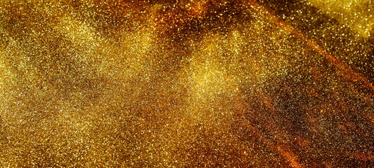 Abstract gold sparkles background with sunlight shadow template with copy space. Banner.Christmas, holiday backdrop, wallpaper.