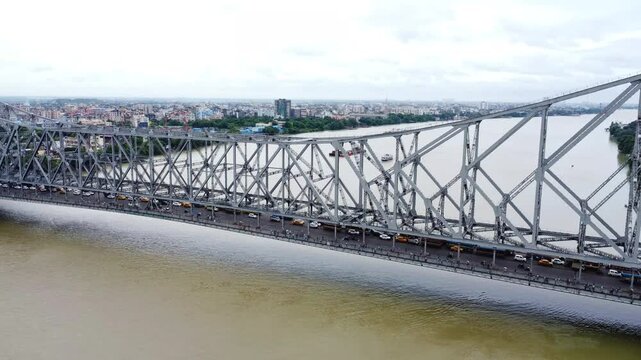 Aerial view of Howrah bridge or Rabindra Setu in Kolkata, West Bengal, India. Heavy traffic of Kolkata city.