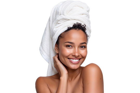 Beautiful woman with glowing skin and a towel wrapped around her head, smiling confidently. Perfect for beauty, spa, and skincare themes