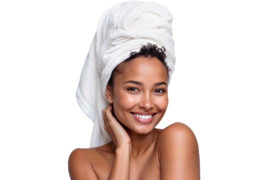 Beautiful woman with glowing skin and a towel wrapped around her head, smiling confidently. Perfect for beauty, spa, and skincare themes