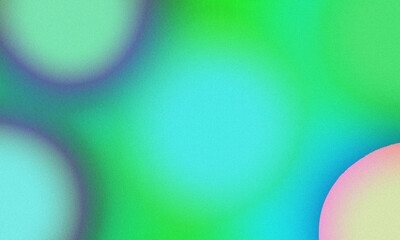 Abstract background with blurred circles in shades of green, blue, and pink creating a dreamy and soft texture