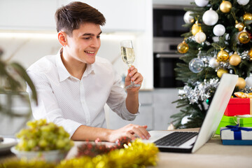 man cheerfully communicates via video call on new year s eve