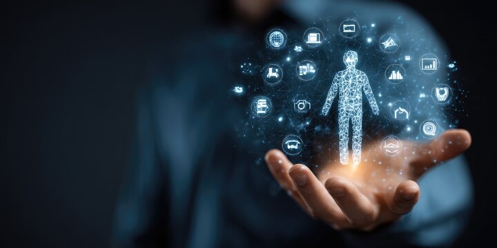 A person's silhouette, outlined with data points and icons, is held in a hand.  A digital representation