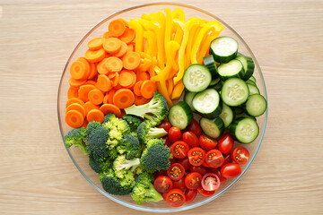 Fresh sliced vegetables arranged in a bowl for a healthy meal.