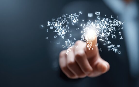 A fingertip touches a digital world map, radiating with interconnected symbols