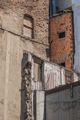 walls of ruined buildings that have collapsed and turned into rubble