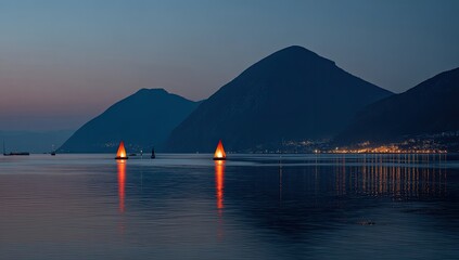 Dusk view of lake with illuminated sails