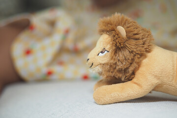 Cozy playtime with a soft lion toy in a sunny room