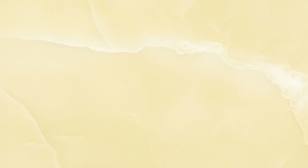 Obraz premium Close-up of a light yellow marble slab with subtle veining.