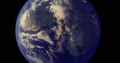 Earth is seen from a distance with vibrant blue oceans and white clouds. City lights twinkle on the dark side, revealing human habitation at night.