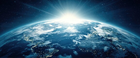 Earth seen from space, sunrise illuminating the globe