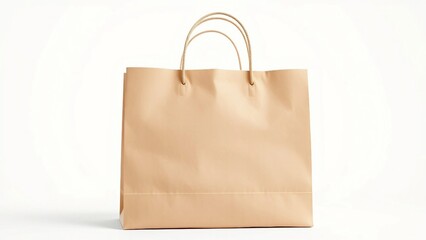 Recyclable brown paper shopping bag with handles isolated on a white studio background. A concept for eco-friendly retail and sustainable consumerism