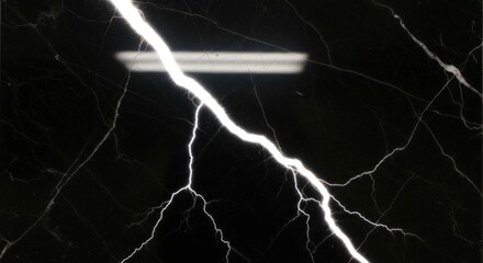 Dramatic image of a lightning bolt striking across a dark, marbled surface.