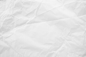 White crumpled paper texture background. Ideal for presentations and branding. Artistic projects that require a realistic recycled paper effect with subtle folds and wrinkles.