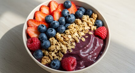 Colorful berry and granola parfait bowl