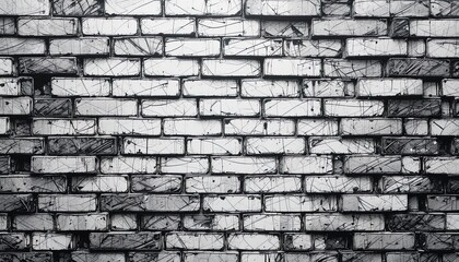 Fototapeta premium A detailed grayscale image of a distressed brick wall, showcasing intricate cracks and textures.
