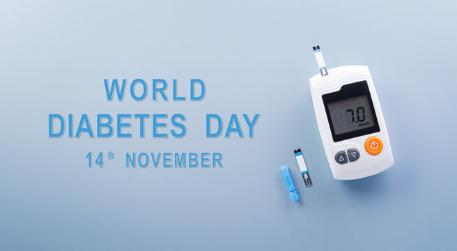 World Diabetes day concept ,14 November. Top view of blood glucose meter sets on pastel blue background,