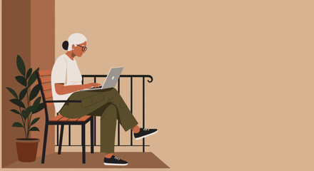 Senior woman working remotely on laptop from a comfortable home balcony, embodying modern independent lifestyle and technology use for business or leisure.