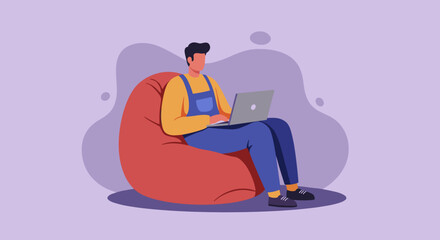 Young man enjoying flexible remote work from home, typing on laptop while relaxing on a comfortable bean bag chair. Modern digital lifestyle concept.
