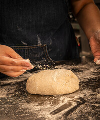 baker kneading and preparing sourdough bread