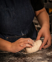 baker kneading and preparing sourdough bread
