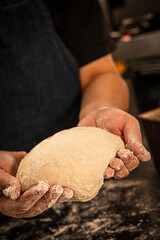 baker kneading and preparing sourdough bread