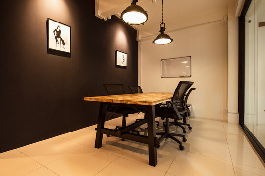 small meeting room with four chairs - Powered by Adobe