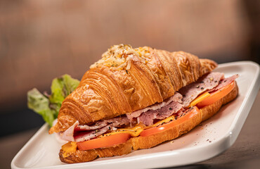 croissant with cooked ham and cheese