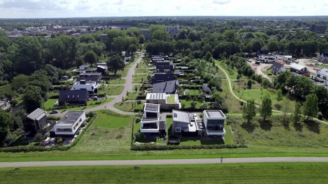 Luxury houses in neighbourhood in Zutphen, The Netherlands, with contemporary architecture. Engineering and infrastructure in Holland