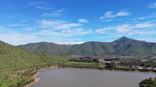 Green hills and the Chada reservoir in the commune of Chada, Paine, Metropolitan Region, Chile