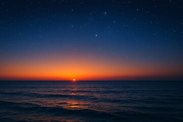 Beautiful sunset over the ocean with a starry sky creating a peaceful seascape