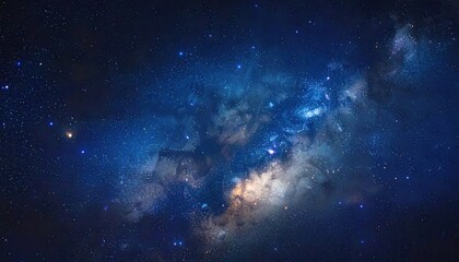 Obraz premium A stunning vista of the night sky, showcasing a vibrant tapestry of stars and nebulae against a deep, rich blue backdrop.
