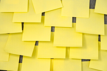Multiple sheets sticky notes on the wall