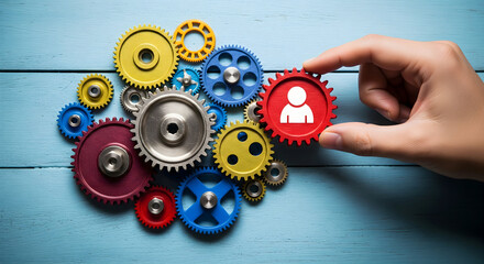 Hand adding team member gear to vibrant group for success, business collaboration concept