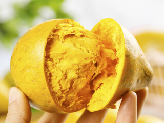 Hainan Lion Egg Fruit Cut Open Showing Yellow Flesh - Tropical Asian Fruit