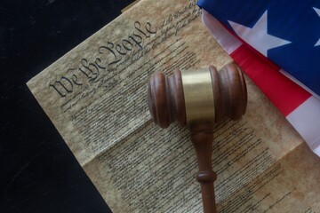 Gavel on US Constitution and Flag