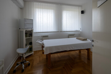 Massage therapy room with two treatment tables
