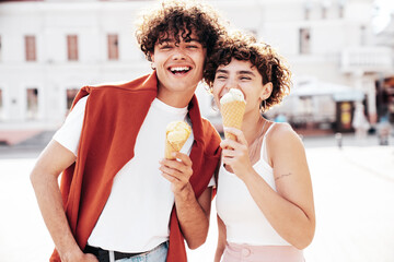 Smiling beautiful woman and her handsome boyfriend. Woman in casual summer clothes. Happy cheerful...