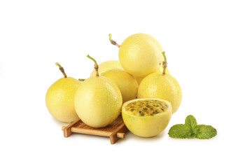 Fresh Yellow Passion Fruits on Wooden Board with Mint Leaves