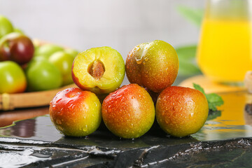 Fresh Ripe Plums with Water Drops on Slate Surface - Healthy Organic Stone Fruit