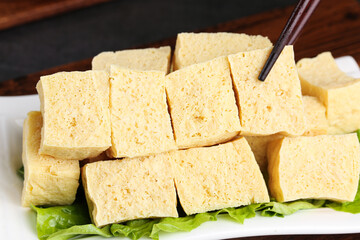 Handmade Fresh Tofu Cubes Presented on Plate with Lettuce Garnish Traditional Asian Protein Food