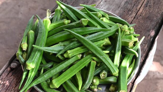 Green okra in wooden bowl prepare for cooking, Organic vegetables. Fresh green okra, Organic vegetable, Asian food ingredients