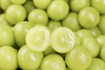 Fresh Green Guizhou Grapes with Water Droplets and Cross-Section Detail