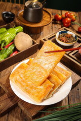 Handmade Golden Potato Pancakes with Fresh Vegetables and Spices on Rustic Wooden Table