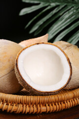 Fresh Hainan Coconut King with White Meat and Milk on Tropical Palm Background